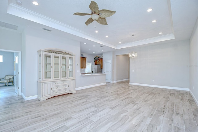 5732 Stockport St, Riverview, FL 33578 - unfurnished living room with ceiling fan with notable chandelier, crown molding, baseboards, a raised ceiling, and recessed lighting