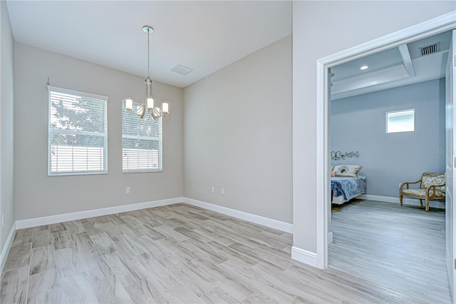 5732 Stockport St, Riverview, FL 33578 - unfurnished dining area featuring a chandelier, light wood finished floors, baseboards, and visible vents