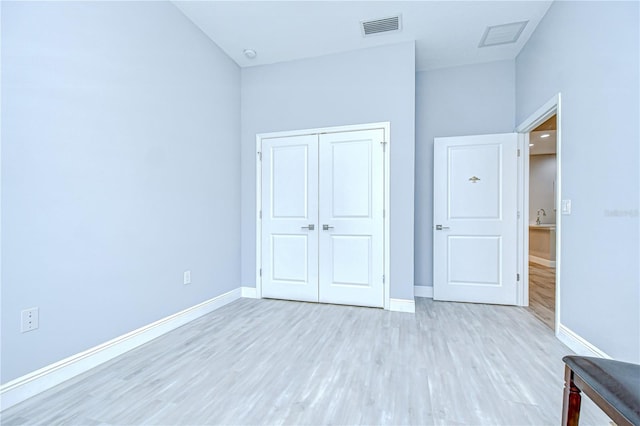 5732 Stockport St, Riverview, FL 33578 - unfurnished bedroom featuring light wood finished floors, baseboards, a closet, and visible vents
