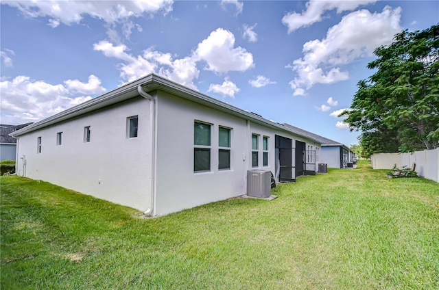5732 Stockport St, Riverview, FL 33578 - back of property featuring a yard, fence, stucco siding, and central AC unit