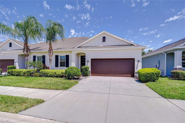 5732 Stockport St, Riverview, FL 33578 - ranch-style house with an attached garage, concrete driveway, stucco siding, and a front lawn