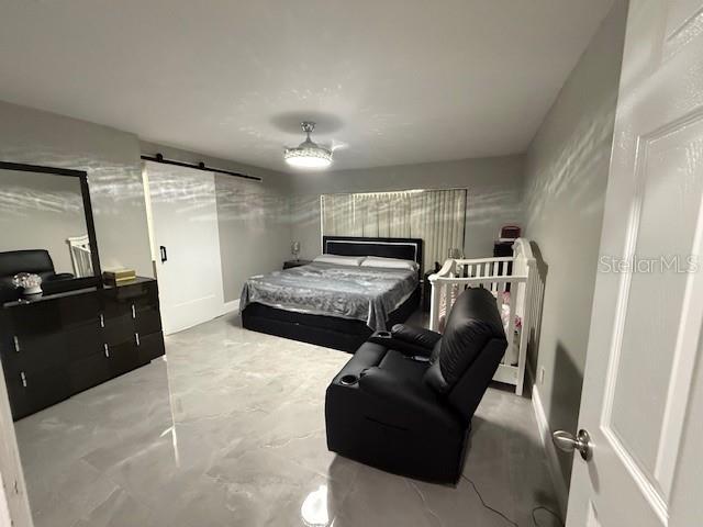 1710 Tallowtree Cir, Valrico, FL 33594 - bedroom featuring baseboards