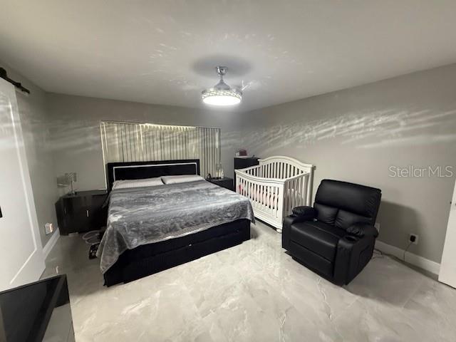 1710 Tallowtree Cir, Valrico, FL 33594 - bedroom with baseboards