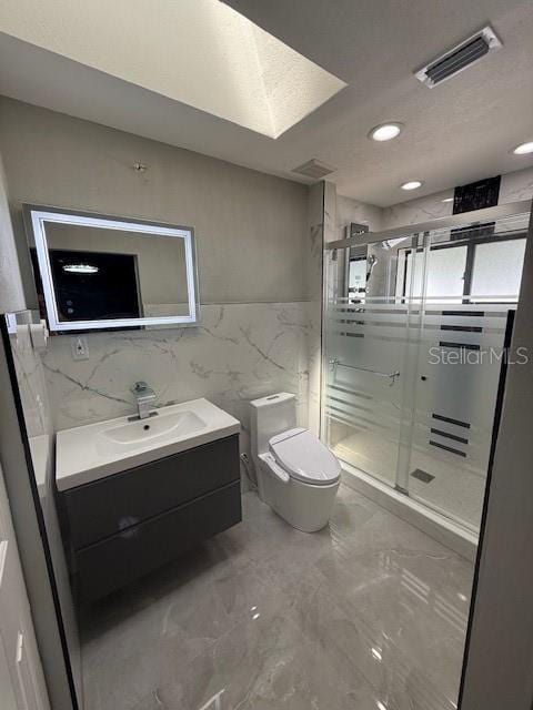 1710 Tallowtree Cir, Valrico, FL 33594 - full bathroom featuring tile walls, toilet, marble finish floor, visible vents, and vanity