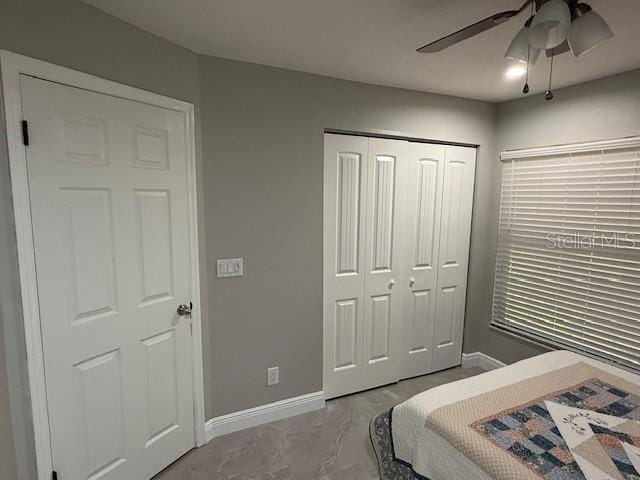 1710 Tallowtree Cir, Valrico, FL 33594 - bedroom with a closet, marble finish floor, baseboards, and ceiling fan