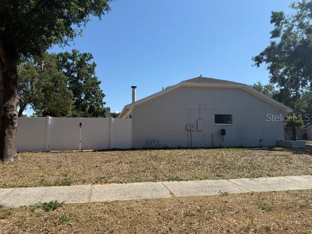 1710 Tallowtree Cir, Valrico, FL 33594 - view of side of property featuring fence