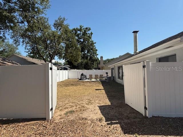 1710 Tallowtree Cir, Valrico, FL 33594 - view of yard featuring a fenced backyard