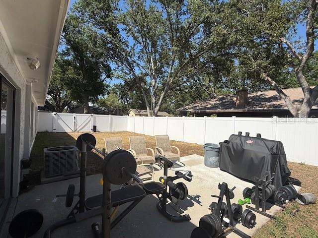 1710 Tallowtree Cir, Valrico, FL 33594 - exterior space featuring cooling unit and a fenced backyard