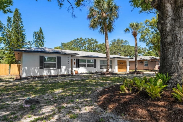 14 S Meteor Ave, Clearwater, FL 33765 - ranch-style house featuring an attached garage and stucco siding