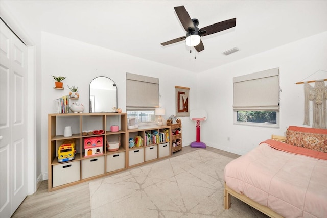 14 S Meteor Ave, Clearwater, FL 33765 - bedroom featuring wood finished floors, baseboards, and ceiling fan