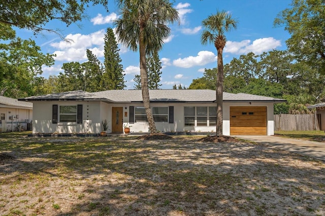 14 S Meteor Ave, Clearwater, FL 33765 - view of front of home featuring a garage, driveway, and stucco siding