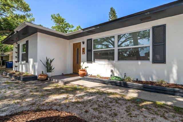 14 S Meteor Ave, Clearwater, FL 33765 - doorway to property with stucco siding