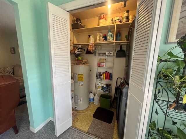 utility room featuring water heater