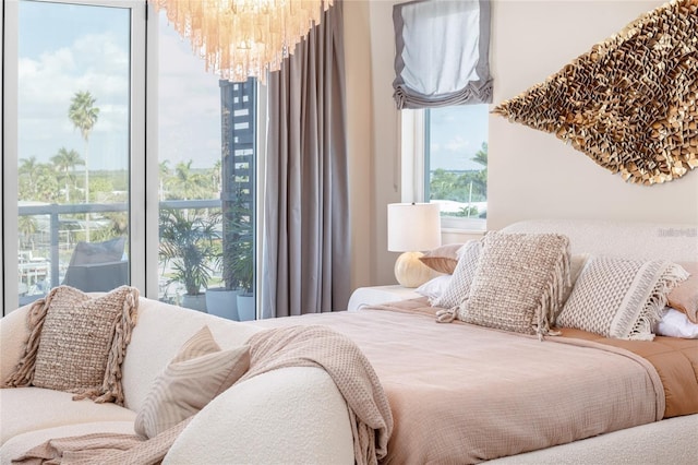bedroom featuring a notable chandelier