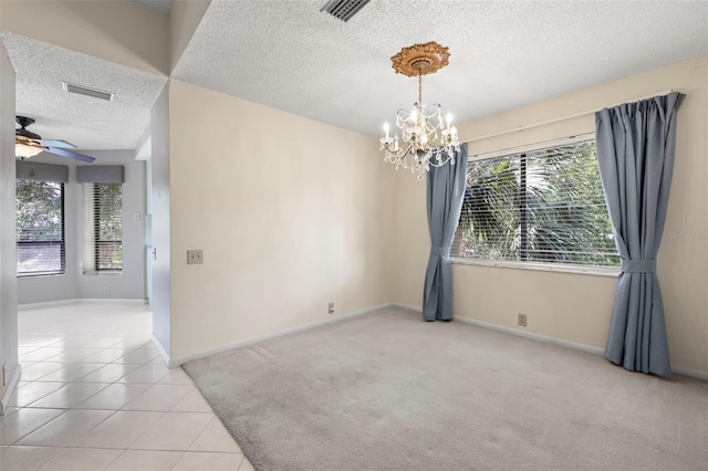 3066 Landmark Blvd Unit 1305, Palm Harbor, FL 34684 - spare room with a textured ceiling, a chandelier, ceiling fan, baseboards, and light tile patterned floors