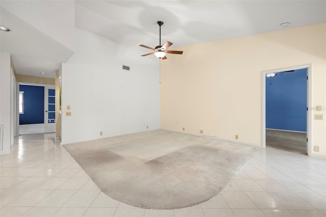 3066 Landmark Blvd Unit 1305, Palm Harbor, FL 34684 - unfurnished room featuring light tile patterned floors, ceiling fan, a towering ceiling, and a smoke detector