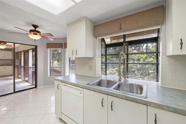 3066 Landmark Blvd Unit 1305, Palm Harbor, FL 34684 - kitchen with white dishwasher, a sink, tasteful backsplash, ceiling fan, and a textured ceiling