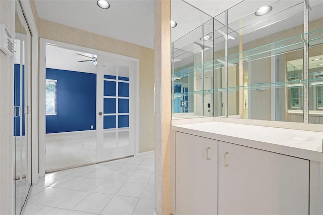 3066 Landmark Blvd Unit 1305, Palm Harbor, FL 34684 - bathroom with a ceiling fan, recessed lighting, vanity, tile patterned floors, and french doors