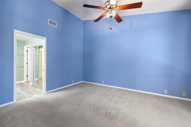 3066 Landmark Blvd Unit 1305, Palm Harbor, FL 34684 - empty room featuring carpet flooring, a ceiling fan, and baseboards