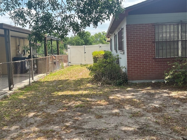 view of yard with a gate and fence