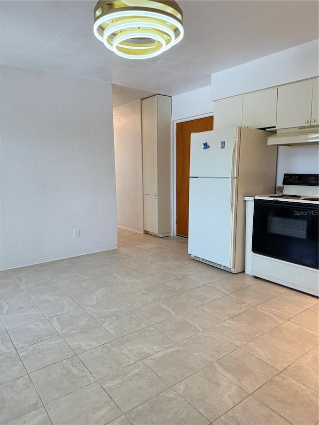 11447 Park Blvd Unit 301, Seminole, FL 33772 - kitchen featuring electric stove, under cabinet range hood, and freestanding refrigerator