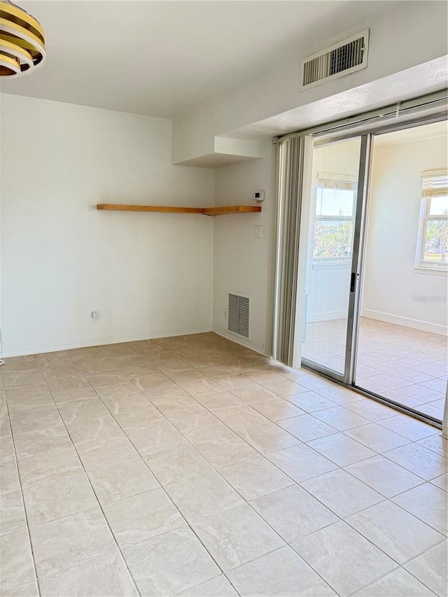 11447 Park Blvd Unit 301, Seminole, FL 33772 - spare room with light tile patterned floors
