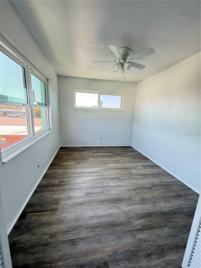 11447 Park Blvd Unit 301, Seminole, FL 33772 - empty room with ceiling fan, dark wood-style flooring, and baseboards