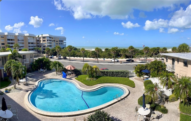 community pool with a patio area