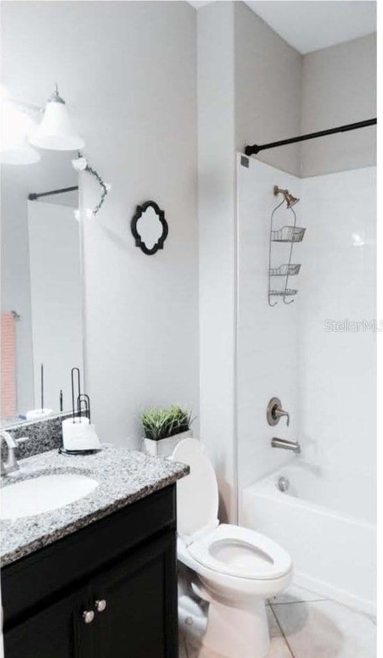 11704 Navajo Sandstone St, Riverview, FL 33579 - full bathroom featuring toilet, vanity, washtub / shower combination, and tile patterned floors