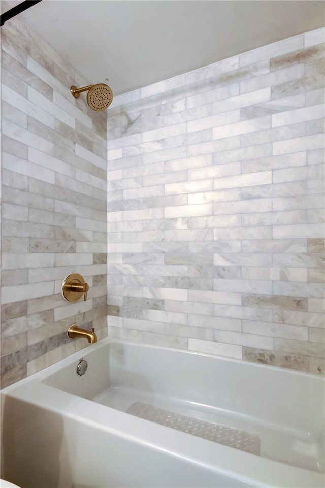 bathroom featuring  shower combination