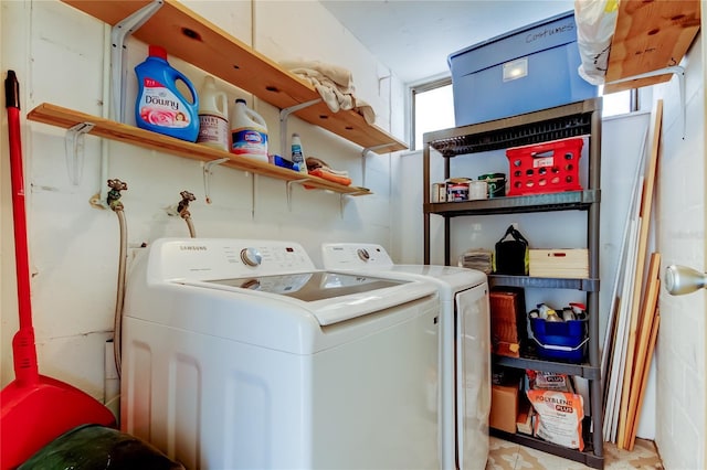 laundry room with washing machine and clothes dryer