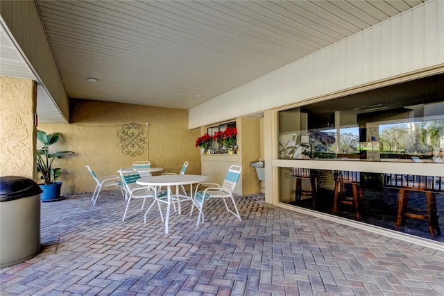 view of patio featuring outdoor dining area