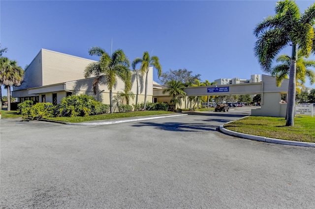 view of asphalt road featuring curbs