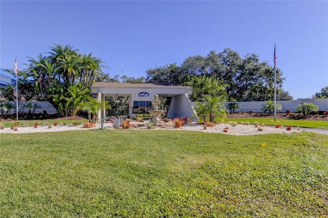 view of front of house with a front yard and stucco siding