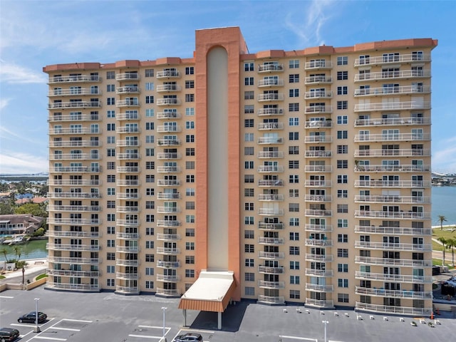 4900 Brittany Dr S Unit 805, Saint Petersburg, FL 33715 - view of apartment building / complex with uncovered parking and a water view