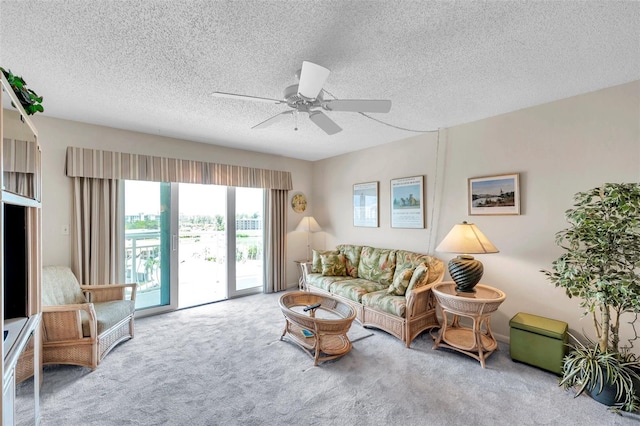 4900 Brittany Dr S Unit 805, Saint Petersburg, FL 33715 - carpeted living area featuring ceiling fan and a textured ceiling
