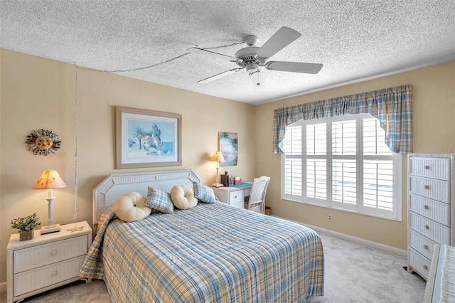4900 Brittany Dr S Unit 805, Saint Petersburg, FL 33715 - bedroom with carpet floors, a textured ceiling, baseboards, and a ceiling fan