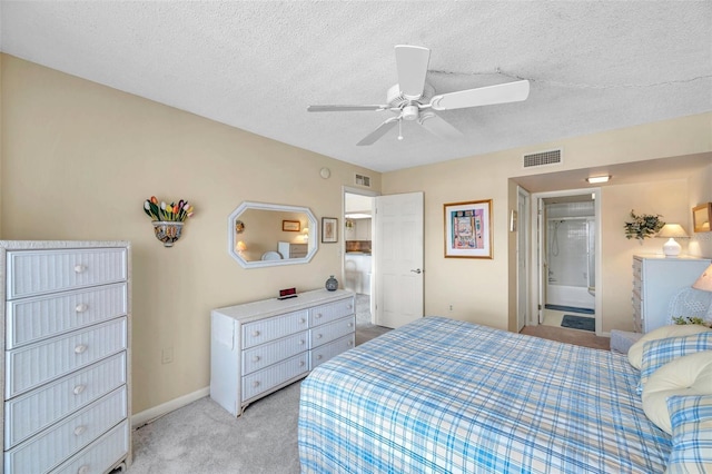 4900 Brittany Dr S Unit 805, Saint Petersburg, FL 33715 - bedroom featuring light carpet, a textured ceiling, ensuite bath, a ceiling fan, and baseboards