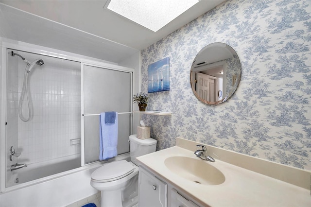 4900 Brittany Dr S Unit 805, Saint Petersburg, FL 33715 - bathroom featuring vanity, wallpapered walls, toilet, and bath / shower combo with glass door