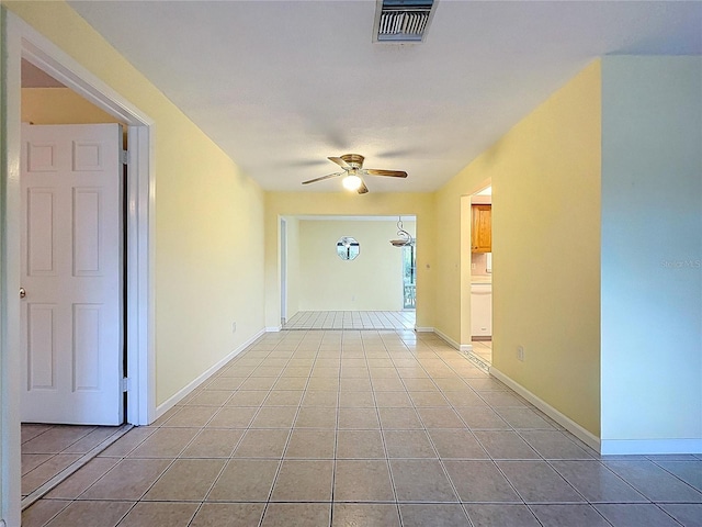 232 Pinecrest Dr, Palm Harbor, FL 34683 - corridor featuring light tile patterned floors and baseboards