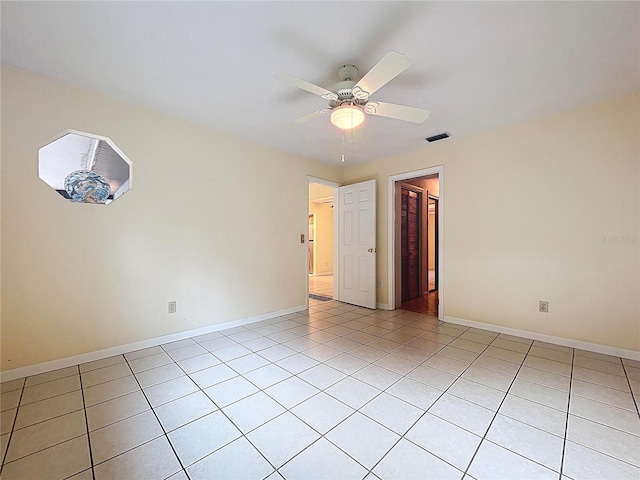 232 Pinecrest Dr, Palm Harbor, FL 34683 - empty room with light tile patterned floors and ceiling fan