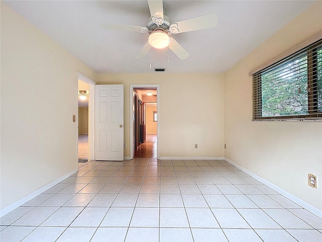 232 Pinecrest Dr, Palm Harbor, FL 34683 - unfurnished room featuring light tile patterned flooring and a ceiling fan