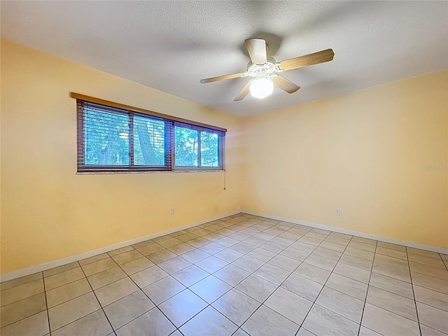 232 Pinecrest Dr, Palm Harbor, FL 34683 - unfurnished room featuring light tile patterned floors, a textured ceiling, and a ceiling fan