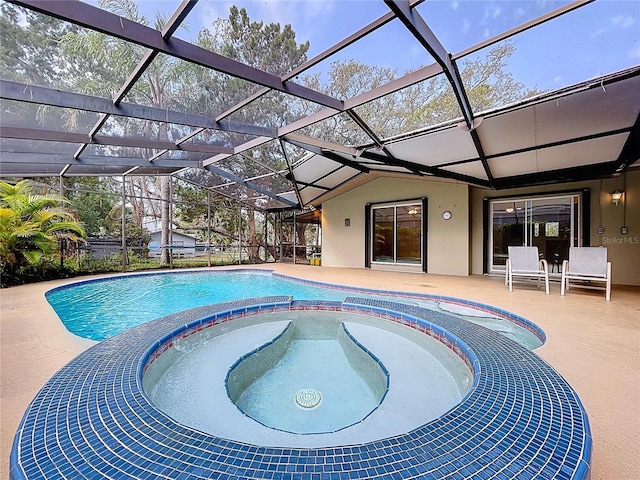 232 Pinecrest Dr, Palm Harbor, FL 34683 - view of swimming pool with a patio, a pool with connected hot tub, and a lanai