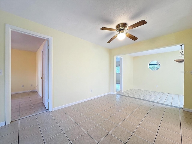 232 Pinecrest Dr, Palm Harbor, FL 34683 - unfurnished room featuring light tile patterned flooring, ceiling fan, and a textured ceiling