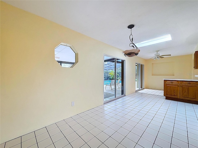 232 Pinecrest Dr, Palm Harbor, FL 34683 - unfurnished living room with a ceiling fan and light tile patterned floors