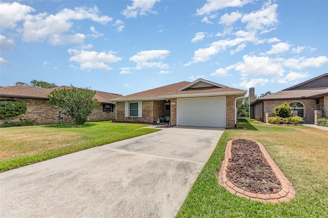 single story home featuring driveway, brick siding, a front yard, and a garage