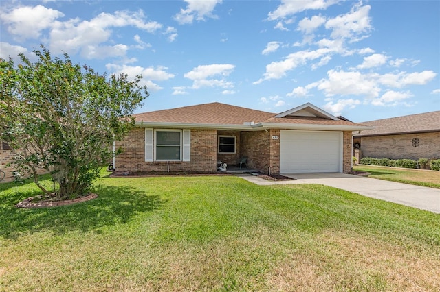 ranch-style home featuring a front yard, an attached garage, brick siding, and driveway