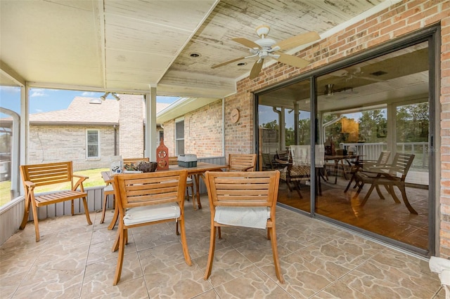 view of patio / terrace with ceiling fan and outdoor dining space