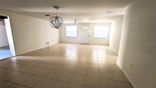 5122 Dove Dr, New Port Richey, FL 34652 - unfurnished dining area with tile patterned flooring, baseboards, and visible vents
